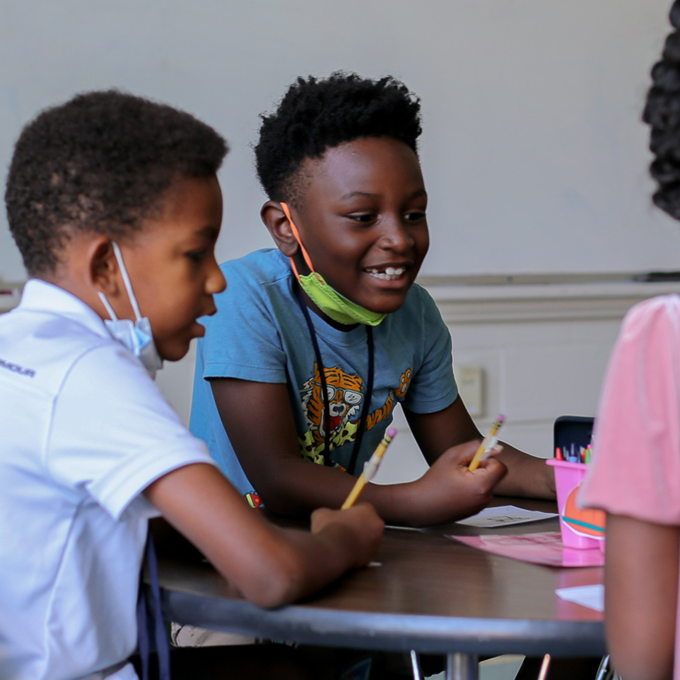 Students sitting at a table together.