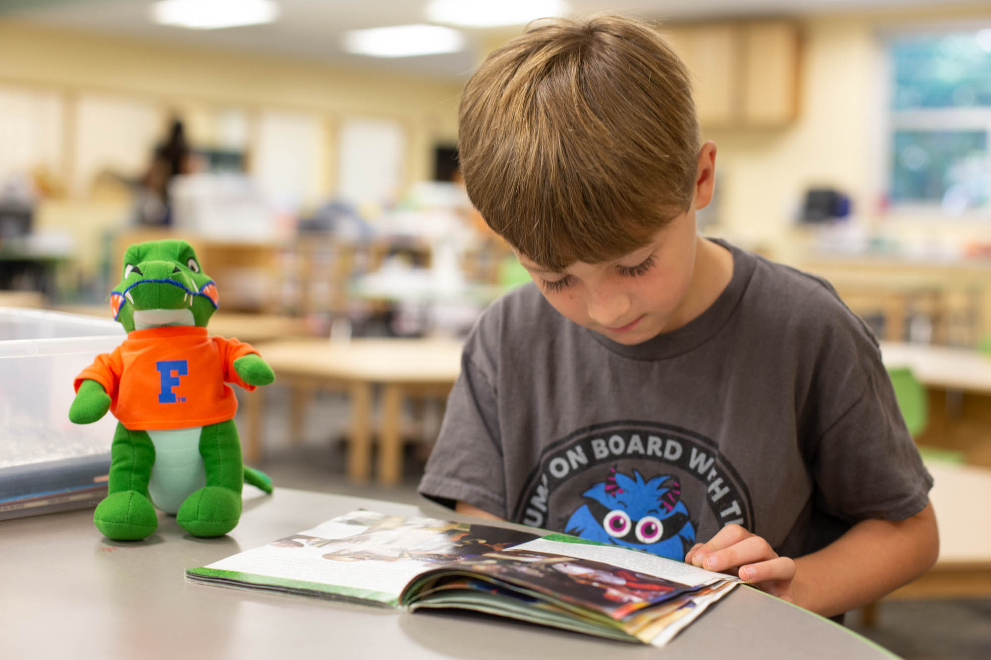 PKYonge-5 Young Student Reading with Albert Gator