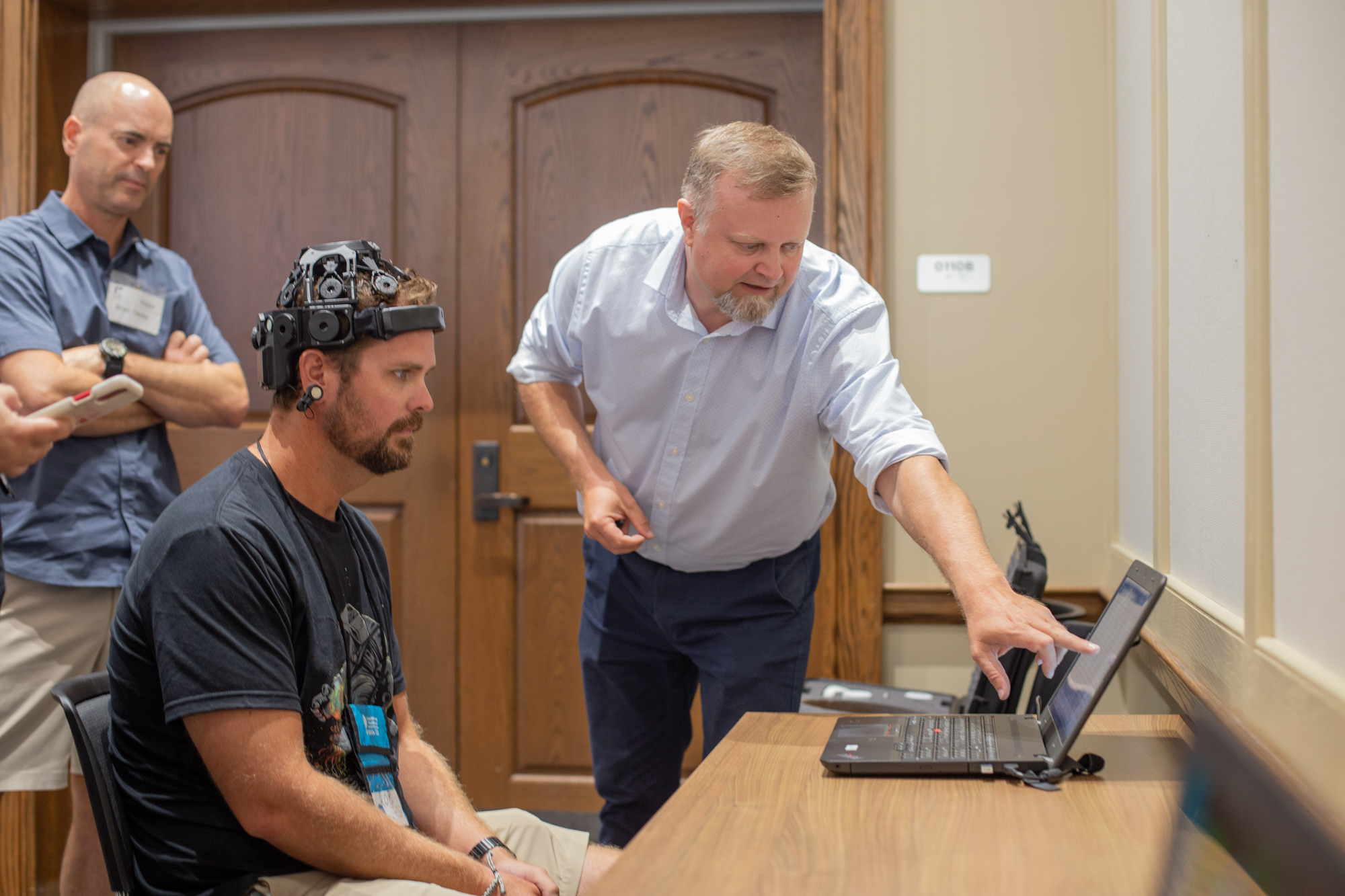 NSF AI Shark Teeth-31 a man trying out a neuroscience device