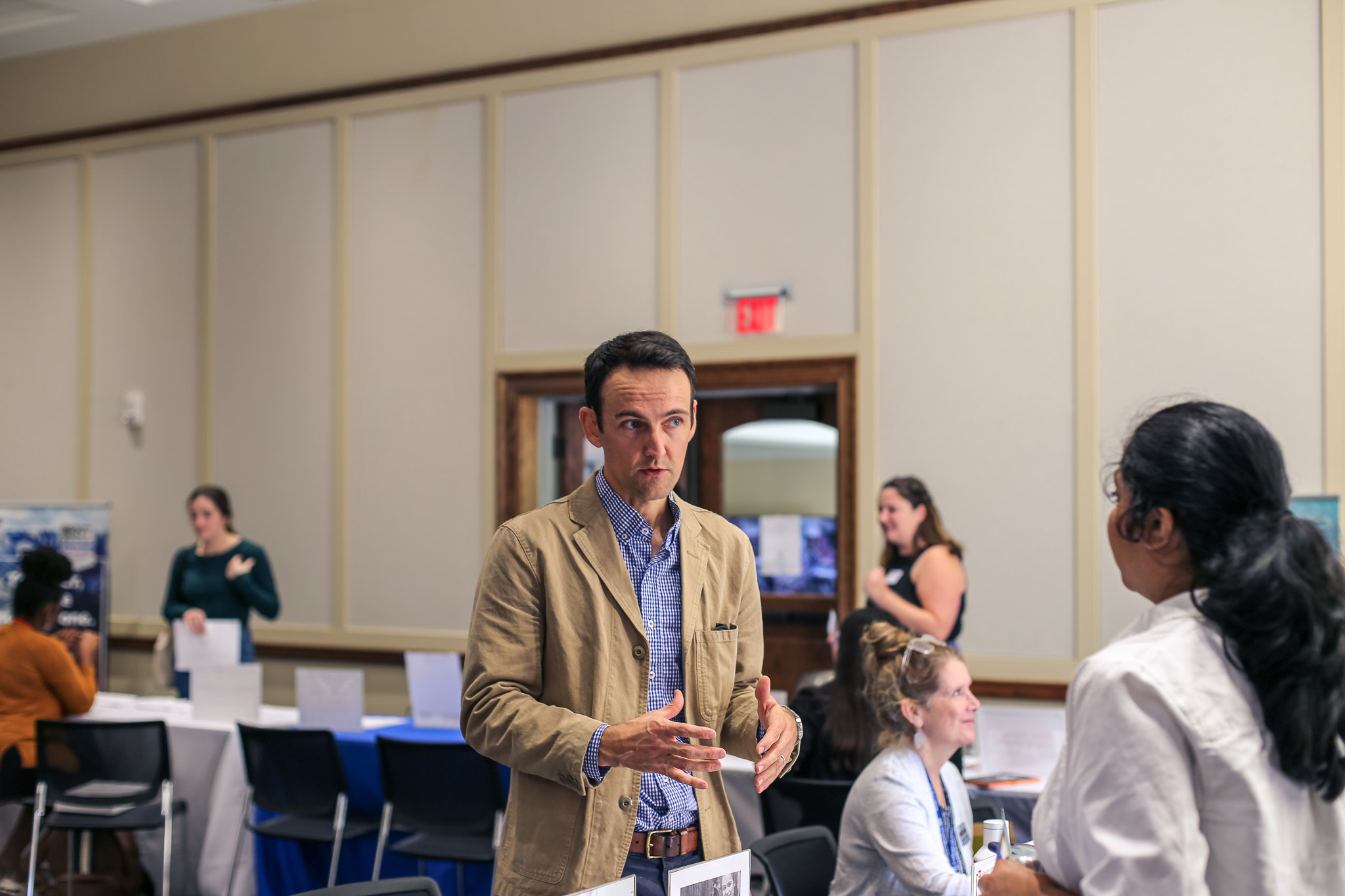 A man speaking to a student