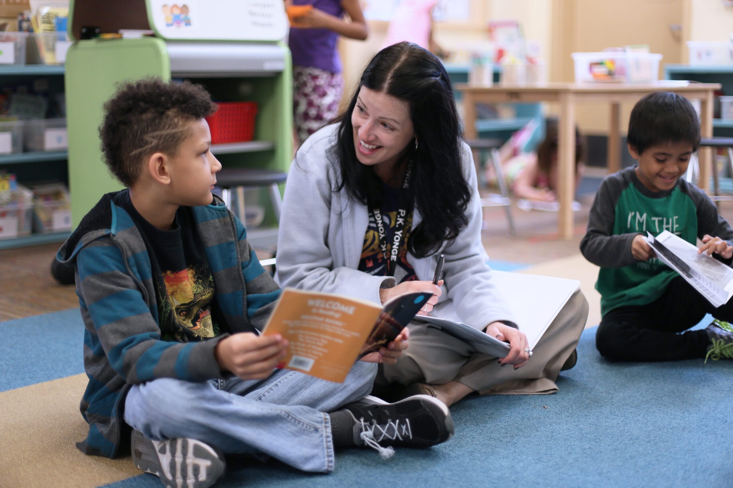 IMG_5516 Teacher reading a book with a elementary school student